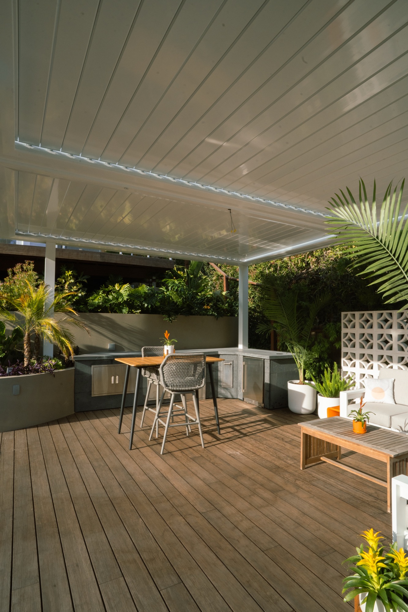 A shaded pergola and outdoor dining area